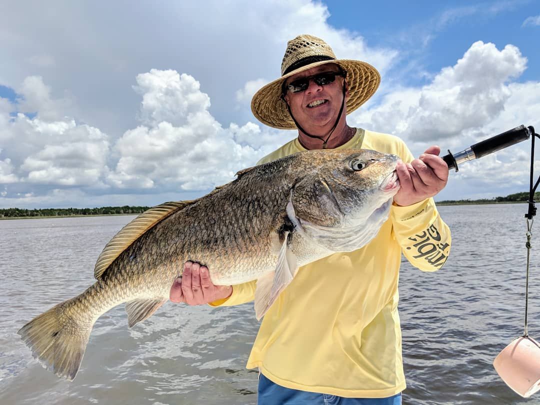 a fisherman with a blackdrum