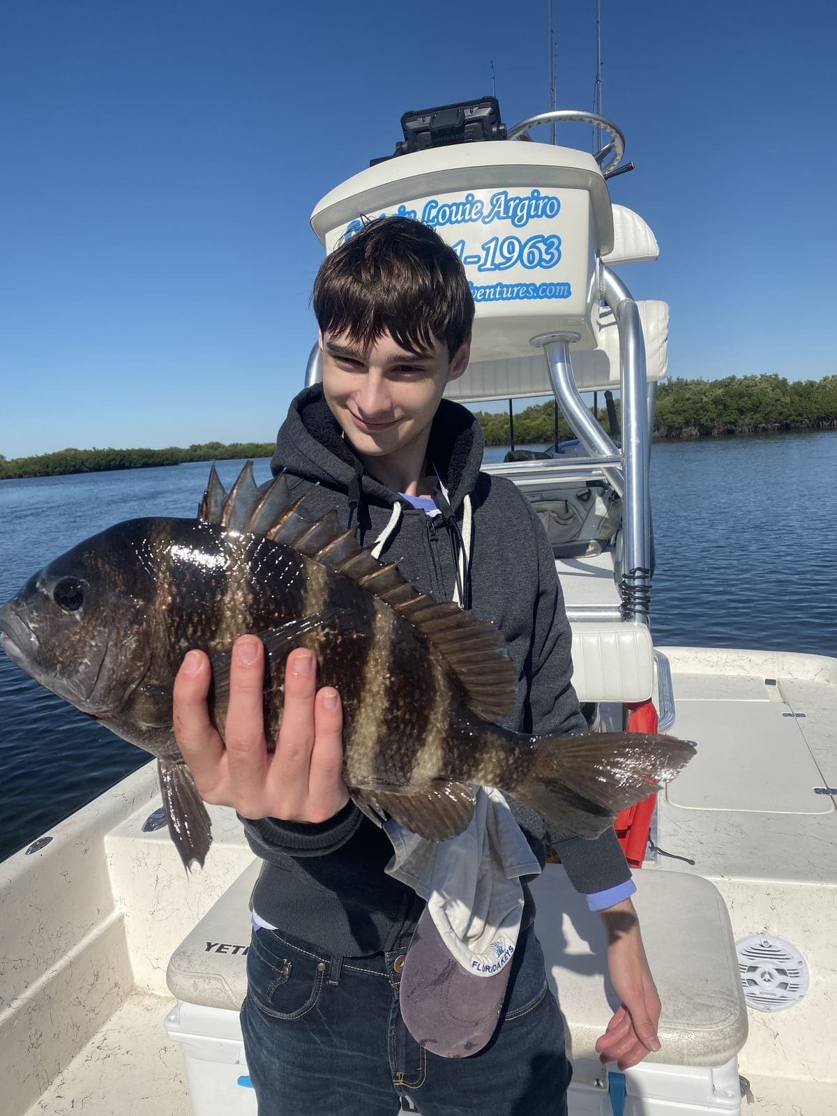 a fisherman with a sheepshead