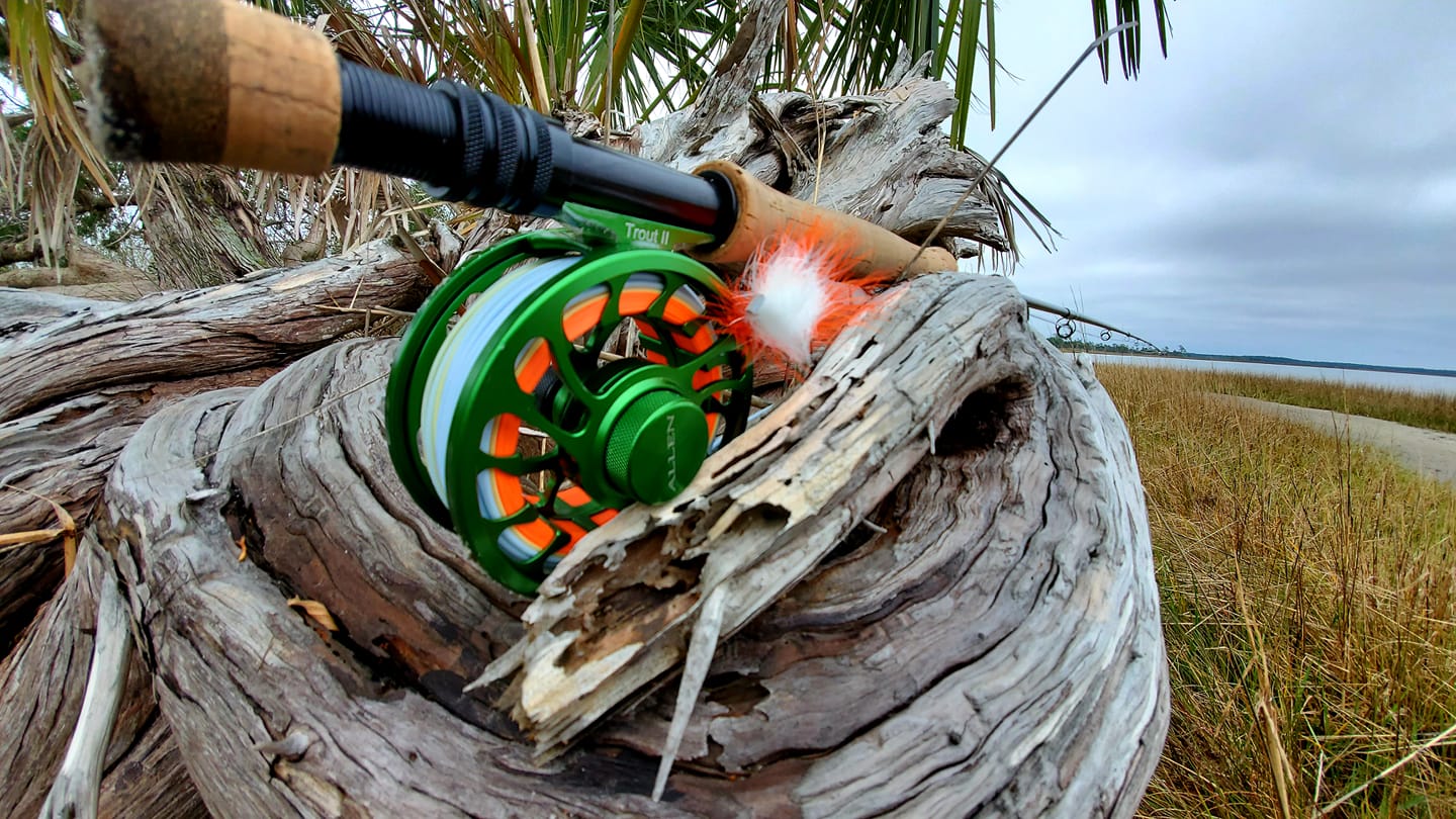 a fly rod sitting on the shore in Crystal River, Florida