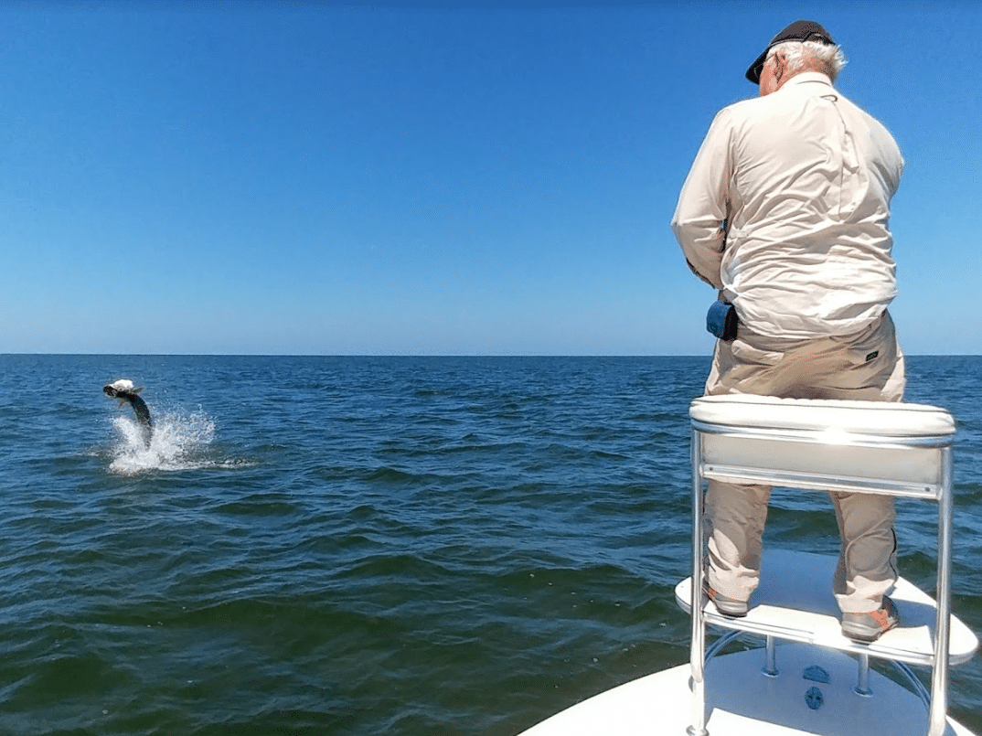 a picture of a fisherman fighting a tarpon in Crystal river