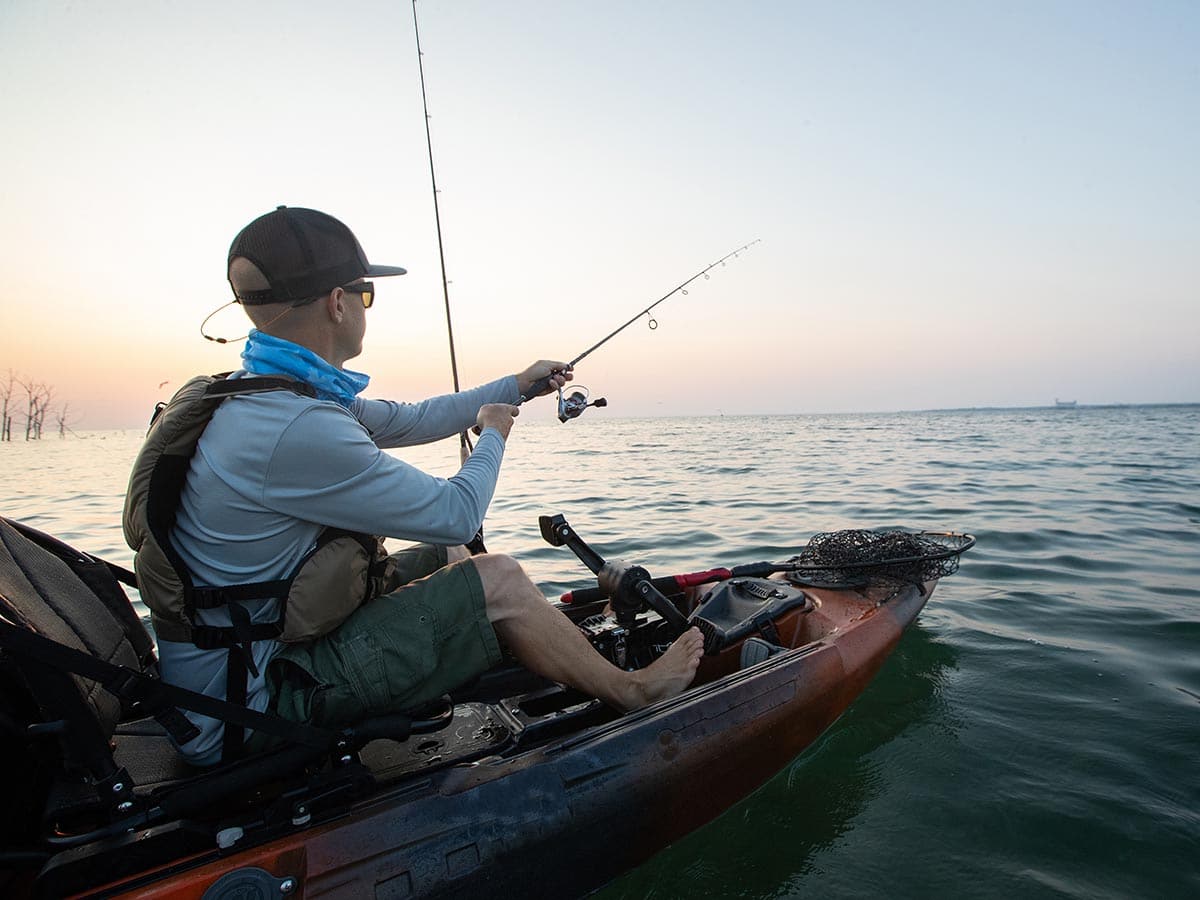 a fisherman on a kayak fishing charter